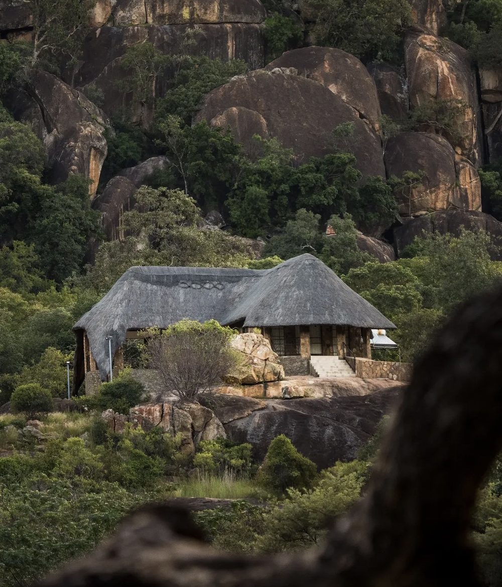 A thatched lodge nestled among the granite boulders of Matobo